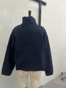 Detailed back view of a navy blue wool jacket with an elegant stand collar for women