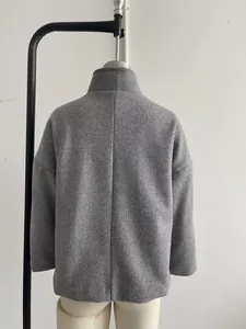 Rear view of an elegant grey wool coat with a chic stand-up collar design for women.