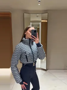 Macro view of a stylish houndstooth pattern ski jacket and high-waisted pants set