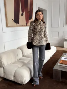Detailed look at slim-fit leopard print faux fur jacket with plush cuffs and stand collar