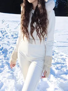 White winter ski jumpsuit with fur hood and belt for women