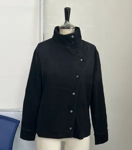 Detail view of black vintage workwear jacket with stand-up collar on mannequin base