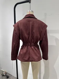 Detailed back view of a premium burgundy lapel cinched waist jacket on a mannequin