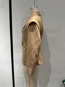 Side view of elegant camel blazer with structured shoulders and cinched waist.