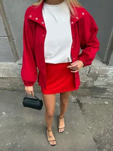 Close-up detail view of a vintage red stand collar jacket with elegant lantern sleeves and buttons