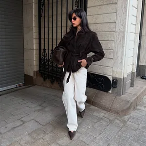 Elegant dark brown belted jacket with lapel in a stylish urban street setting