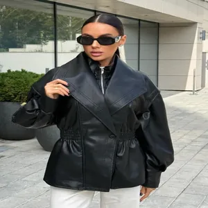 Detailed shot of a black PU leather jacket with oversized lapels and elastic waist