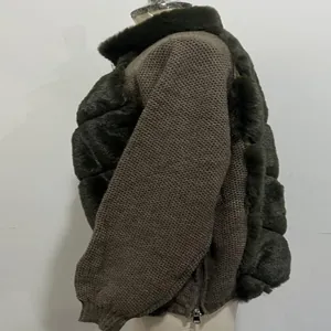 Side view of stylish women's long-sleeve coat with faux fur and knit patchwork detail