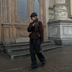 Detailed view of an elegant British style brown suede belted jacket for women