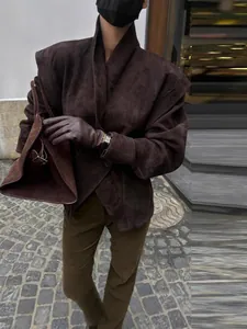Elegant oversized dark brown suede jacket with cinched waist and wide lapels for women.