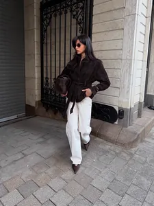 Elegant dark brown belted coat featuring a British lapel design for a chic autumn street look