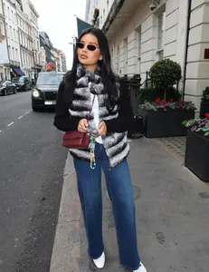Woman in a luxury faux fur patchwork coat on a London street, macro detail view