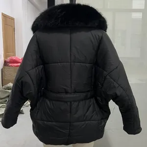Detailed back view of a black padded winter jacket with a detachable fur collar and waist belt