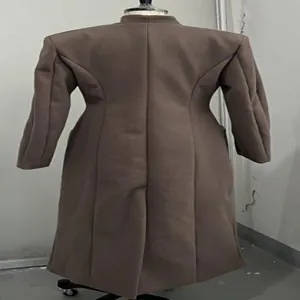 Back view of elegant brown long coat with structured shoulder pads and cinched waist