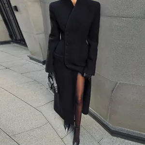 Elegant black long coat with padded shoulders and slim waist silhouette detail