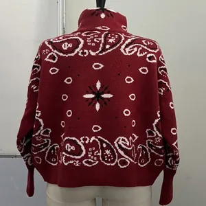 Back view detail of a stylish red retro paisley pattern knitted cardigan sweater for women.