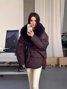 Brown thick padded jacket with oversized fur collar and waist tie for winter.