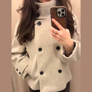 Detail of a chic stand collar double-breasted short wool coat for women in beige.