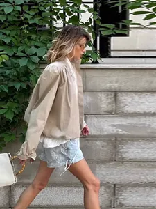 Stylish khaki short windbreaker jacket with shoulder pads and stand collar for modern women