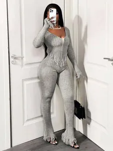 Full body view of a grey ribbed knit set with trendy fringe details and V-neckline