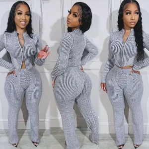 Detailed view of grey ribbed knit two-piece set with double zipper and matching pants