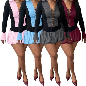 Detailansicht des sexy Schnür-Tops und des bauschigen Skort-Sets in vier Farben