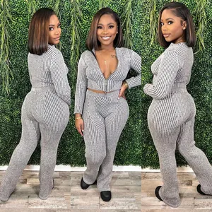Women's grey ribbed knit two-piece set with two-way zipper top and matching pants