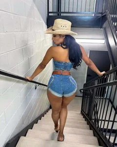 Back view of a sexy heart-shaped washed denim tube top and shorts set on stairs.