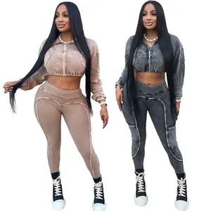 Washed acid-washed two-piece activewear set featuring cropped zip jacket and ribbed leggings