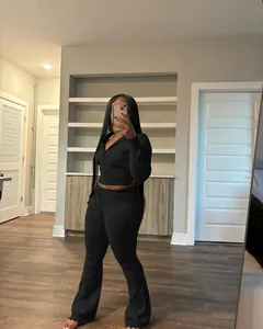 Women's chic black ribbed knit tracksuit set featuring hooded zip-up top and flare trousers