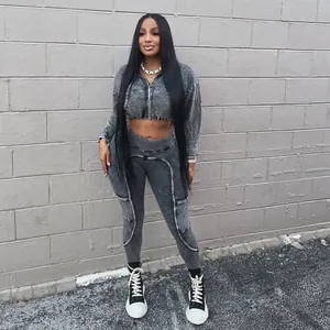 Washed distressed grey two-piece sporty set with zip-up crop top and leggings mode