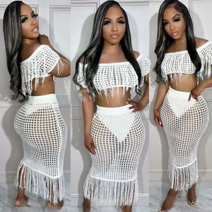 White crochet beach set with off-the-shoulder tassel top and long mesh fringe skirt