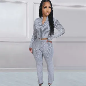 Full view of a grey ribbed knit set featuring a two-way zipper sweater and pants