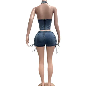 Back view of a sexy denim two-piece set featuring halter top and shorts with zipper details