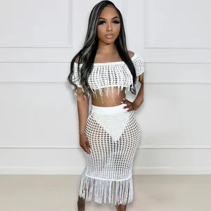 Full length view of white sexy see-through crochet fringe two-piece beach skirt set
