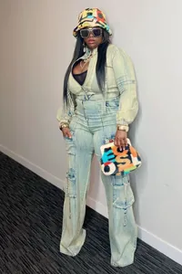 Full body view of stylish light wash denim cargo two-piece set worn by a female model
