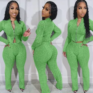 Three-view detail of women's green ribbed knit two-piece set with two-way zipper