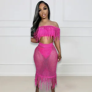 Detailed look of the pink crochet knit two-piece set with long fringe and hollow-out design