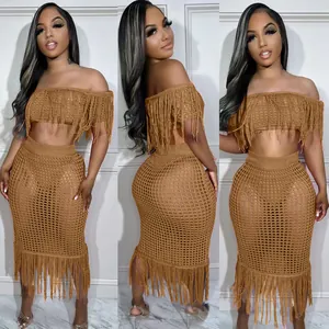 Detailed view of the brown sexy crochet knit texture and long fringe design details