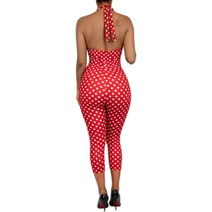 Back view of a sexy red and white polka dot halter neck backless jumpsuit for women