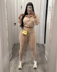 Detailed view of women's beige washed acid-wash distressed patchwork casual set