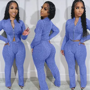 Detail views of a blue two-piece ribbed knit set with a functional double zipper top