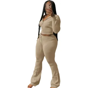 Elegant women's two-piece knitted tracksuit with zip-up hoodie and high-waisted flared pants