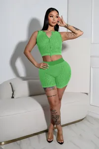 Detail view of two-way zipper on ribbed knit green crop top and shorts set