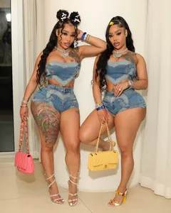 Trendy women's two-piece blue washed denim set with heart-shaped design on top and shorts