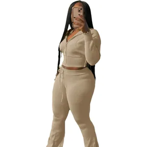 Detail view of women's beige knit 2-piece casual tracksuit with zip hoodie and pants