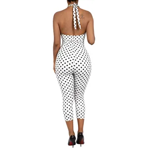 Macro detail back view of a sexy black and white polka dot halter neck jumpsuit