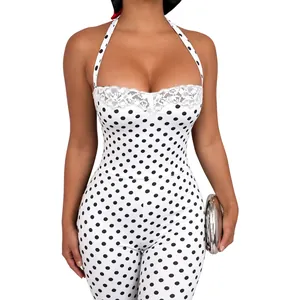 Close-up of sexy polka dot halter neck bodysuit featuring delicate white lace trim details
