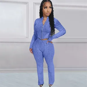 Detailed view of women's blue ribbed knit two-piece set with two-way zipper jacket