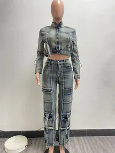 Detail shot of a women's two-piece washed denim set with a cropped jacket and cargo pants.